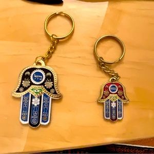 Set of 2 HAMSA Key Chains with Hebrew word for “LUCK” in the center